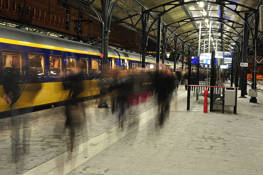 Motion blur commuters at Groningen railway station at night
