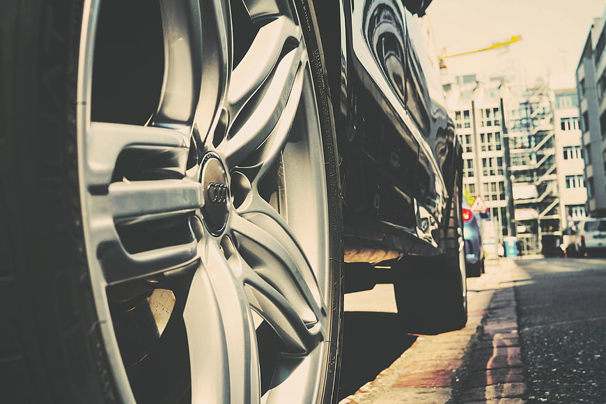 Close-up of Audi car wheel on city street
