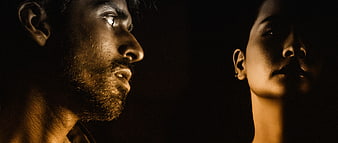 Cinematic Dark Portrait of Man and Woman in Profile