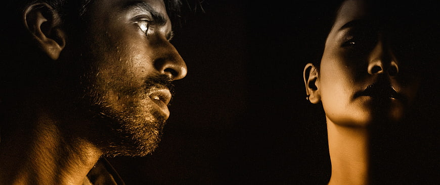 Cinematic Dark Portrait of Man and Woman in Profile