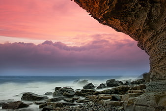 Dramatic Pink Sunset Over Rocky Scottish Coastline