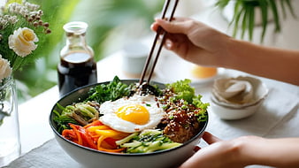 Colorful Bibimbap Bowl with Fried Egg and Fresh Vegetables