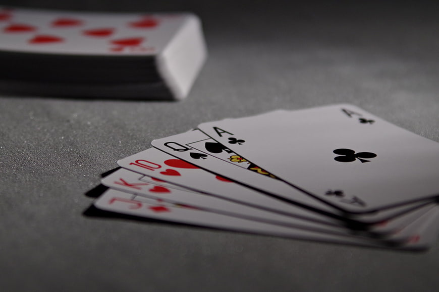 Royal Flush Playing Cards on Gray Table