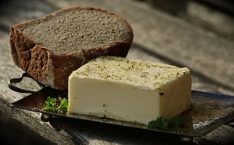 Herb Butter Block and Rustic Bread Loaf on Metal Tray