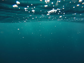 Underwater Ocean Surface View With Bubbles And Light