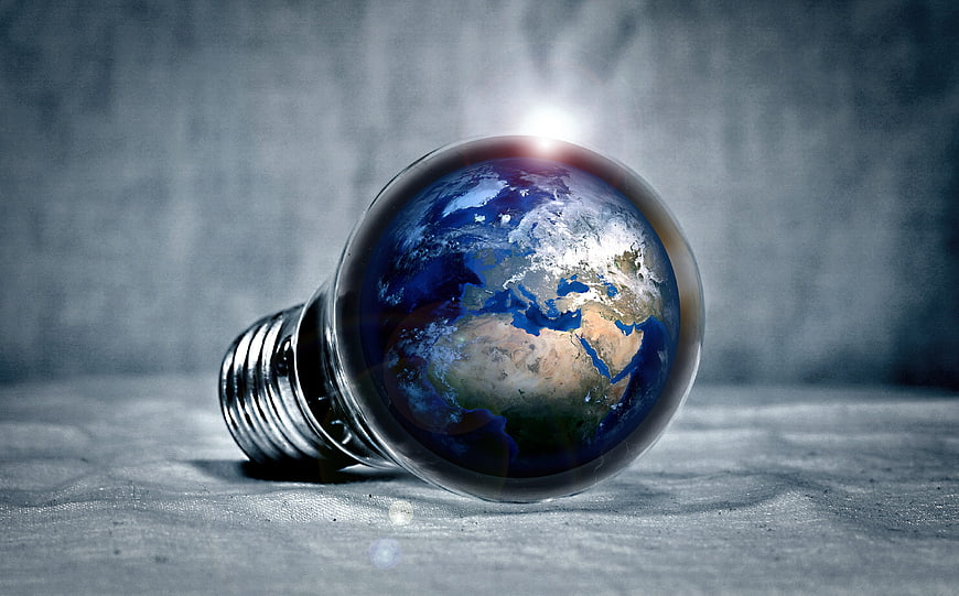 Lightbulb with Earth Inside Symbolizing Global Energy Innovation