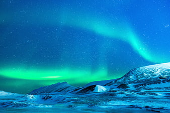 Vibrant Aurora Borealis Over Snowy Arctic Landscape at Night
