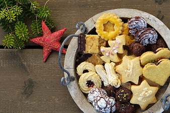 Top View of Christmas Cookies in Wooden Bowl with Pine Branches