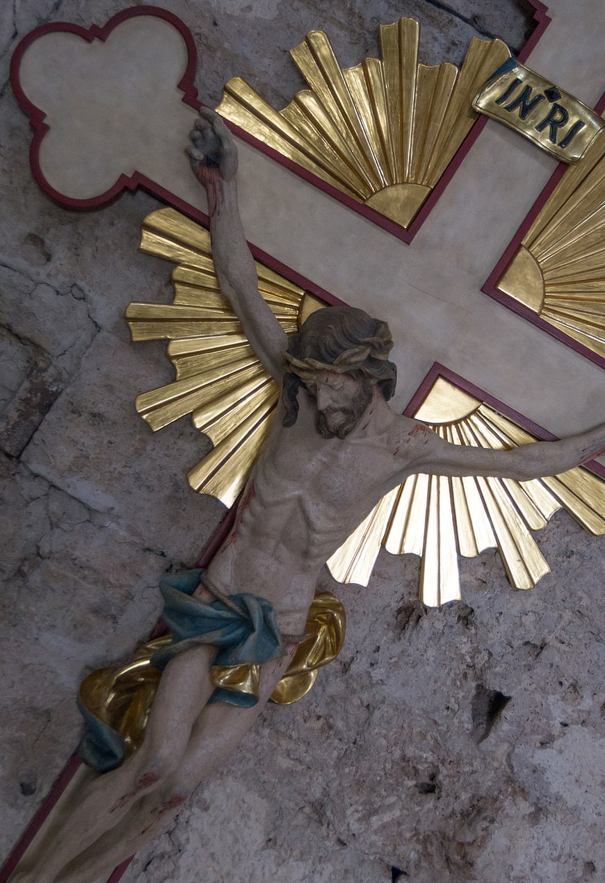 Statue of Jesus on Cross with Gold Rays