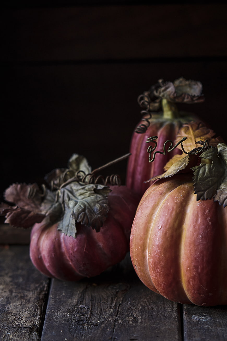 Rustic Red Pumpkins on Dark Wood Table