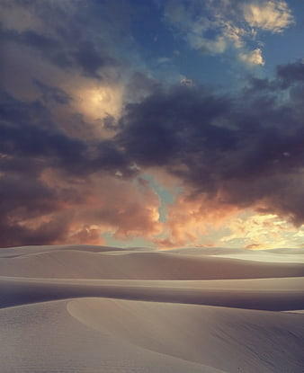 Dramatic Sunset Over White Sand Dunes