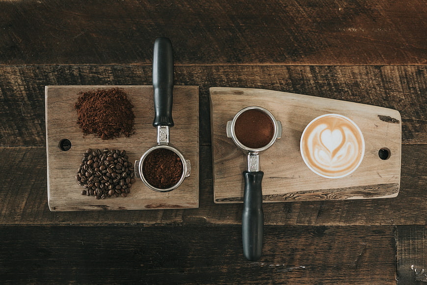 Flat lay of coffee making process with beans and latte art
