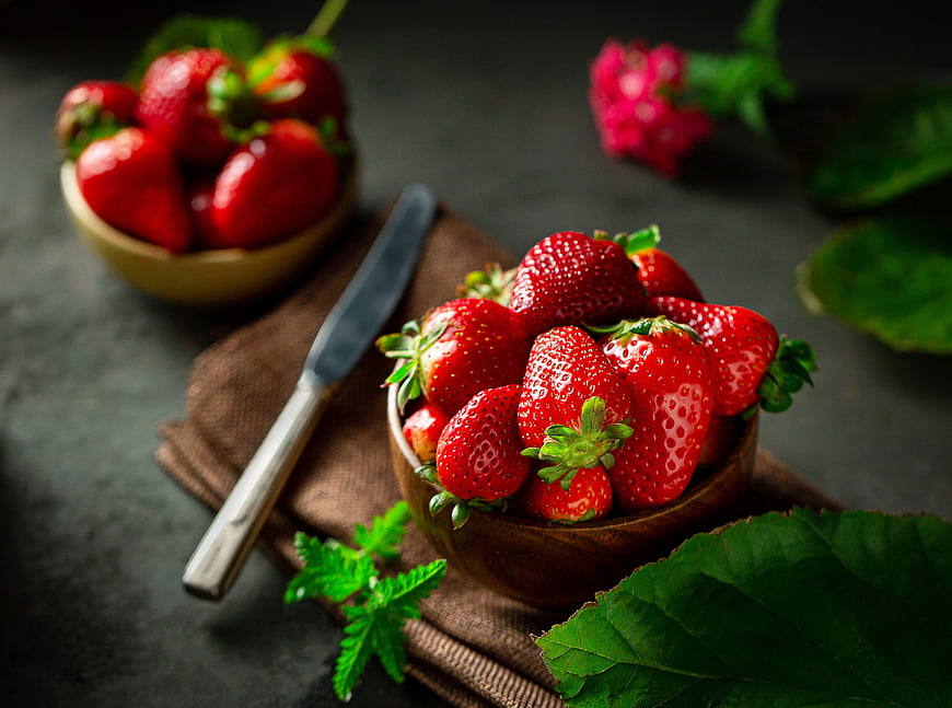Fresh Strawberries in Wooden Bowl on Dark Background
