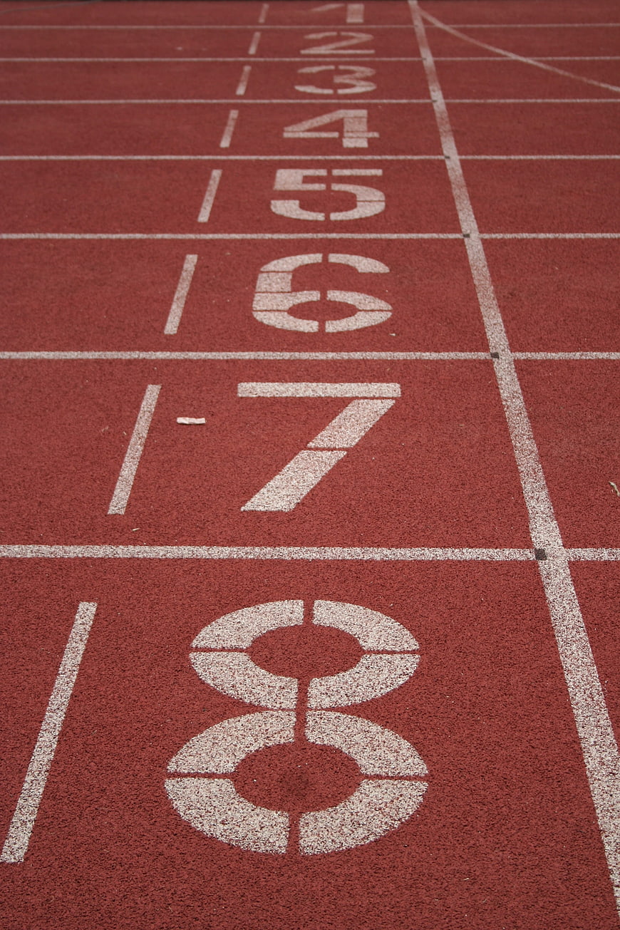 Red Running Track Lanes with White Numbers