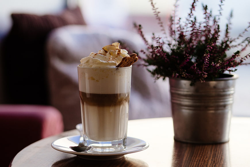 Layered Iced Coffee with Whipped Cream and Cookie Garnish