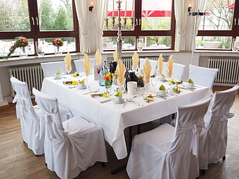Elegant Wedding Banquet Table Setting with White Linens