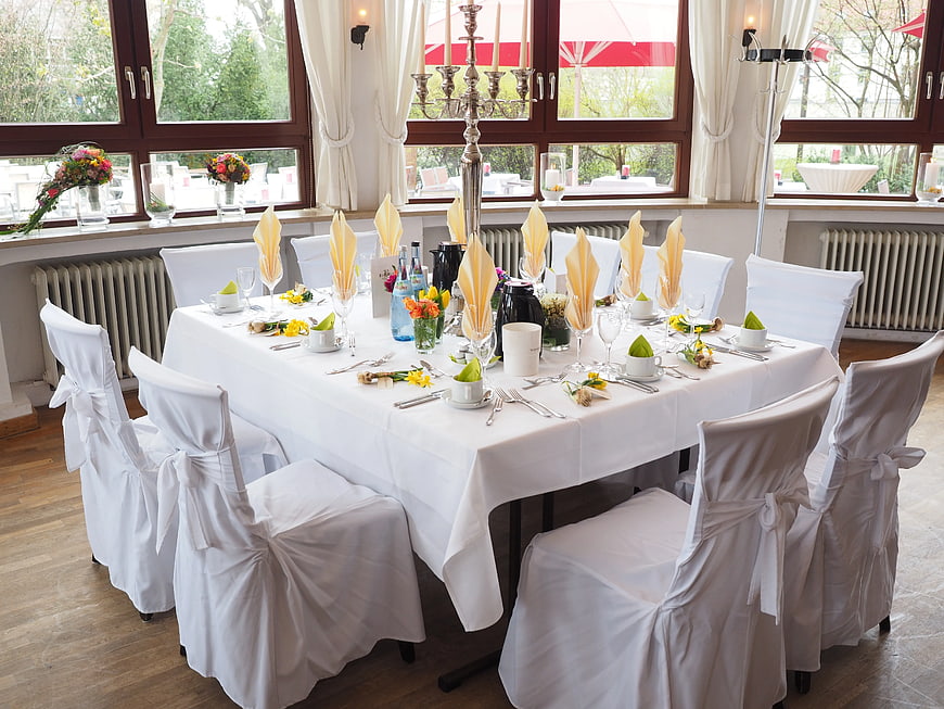 Elegant Wedding Banquet Table Setting with White Linens