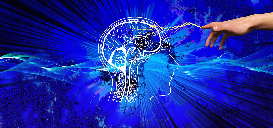 Conceptual illustration of human hand touching glowing brain with electric spark