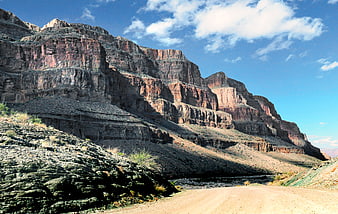 Dirt Road Winding Through Red Rock Desert Canyon
