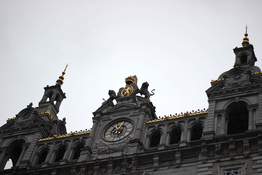 Low angle view of ornate grey architecture with gold accents