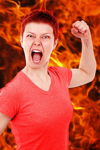 Angry woman screaming with fire background