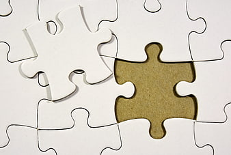White puzzle pieces with missing piece and loose piece