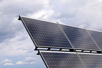 Solar Panels Against Cloudy Sky for Renewable Energy