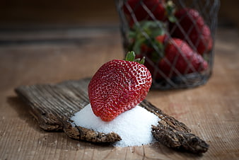 Fresh Strawberry on Sugar with Rustic Wood Background