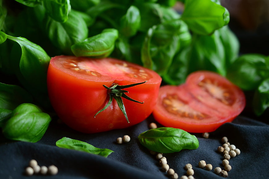 Fresh Red Tomatoes and Basil Leaves with White Peppercorns