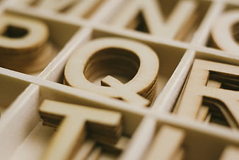 Close-up of wooden letters in a type case