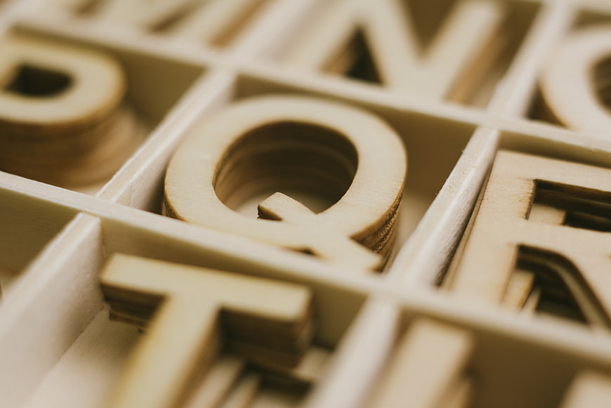 Close-up of wooden letters in a type case