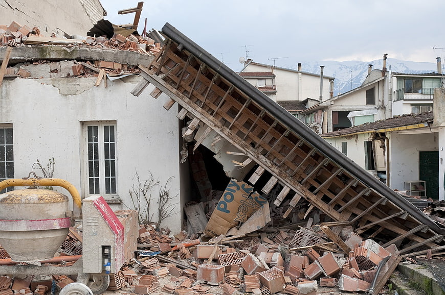 Collapsed house with rubble and debris after earthquake