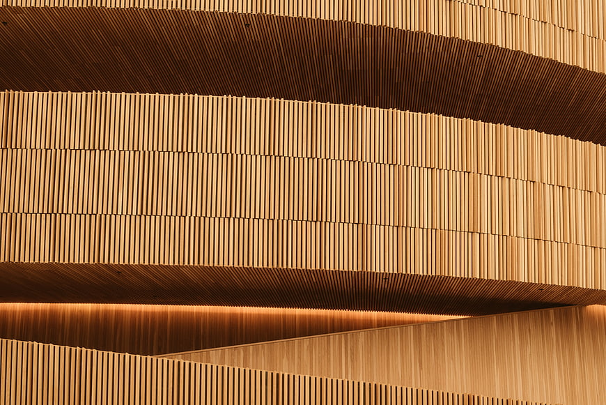 Modern wooden slat wall with curved architectural details