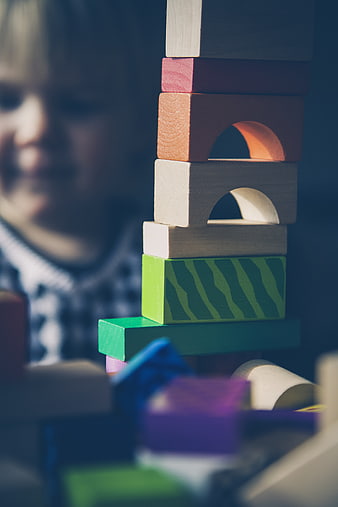 Child Playing with Wooden Blocks