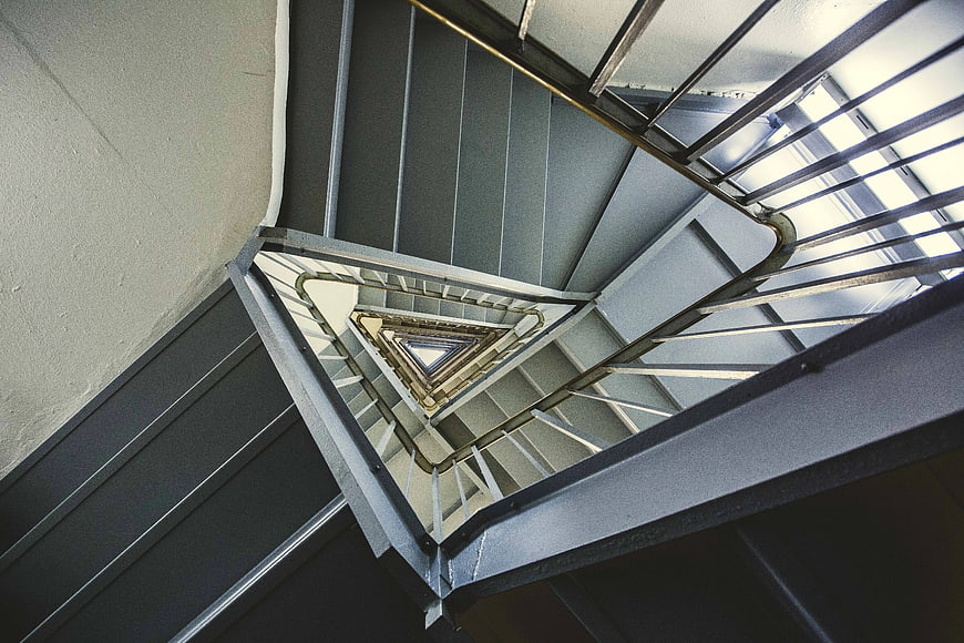 Abstract geometric spiral staircase looking down