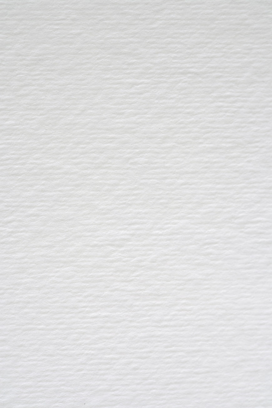 White textured paper background for design and copy space