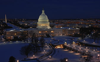 US Capitol Building Illuminated at Night in Snow