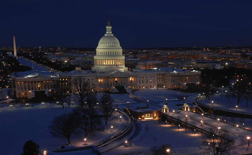 US Capitol Building Illuminated at Night in Snow