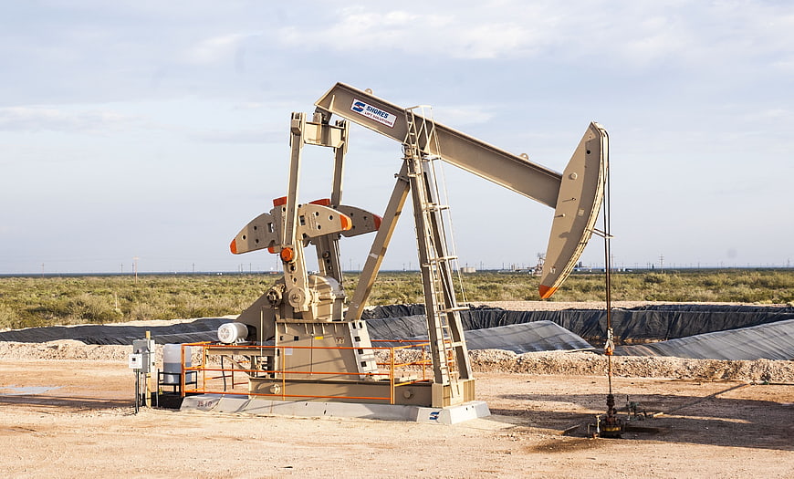 Industrial Oil Pump Jack In Desert Landscape