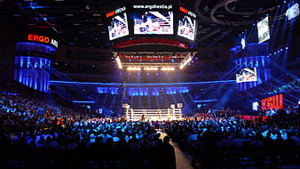 Wide shot of a wrestling event at Ergo Arena with a large crowd