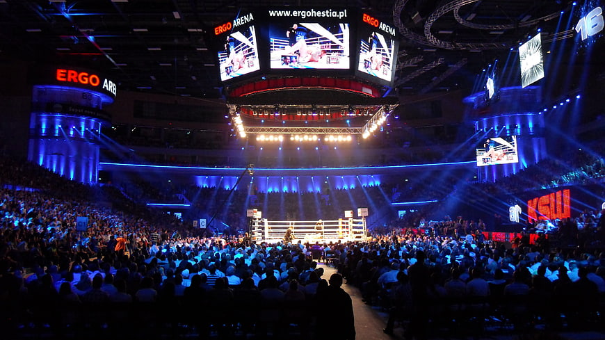 Wide shot of a wrestling event at Ergo Arena with a large crowd