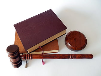 Wooden Gavel and Law Books on White Background