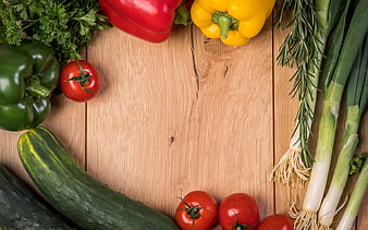 Fresh vegetables and herbs on wooden background with copyspace