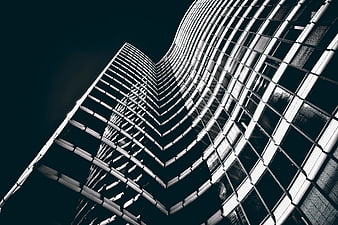 Low-angle view of modern curved skyscraper architecture