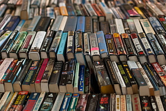 Close-up of colorful book spines on a library shelf
