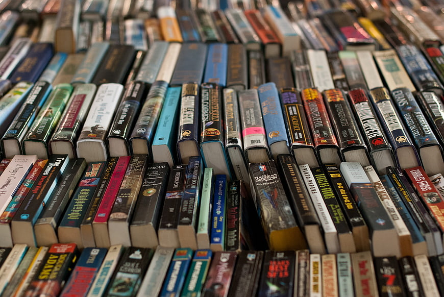 Close-up of colorful book spines on a library shelf