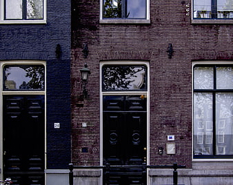 Traditional Dutch Canal Houses with Brick Facades and Doors
