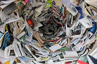 Chaotic Pile of Books and Magazines