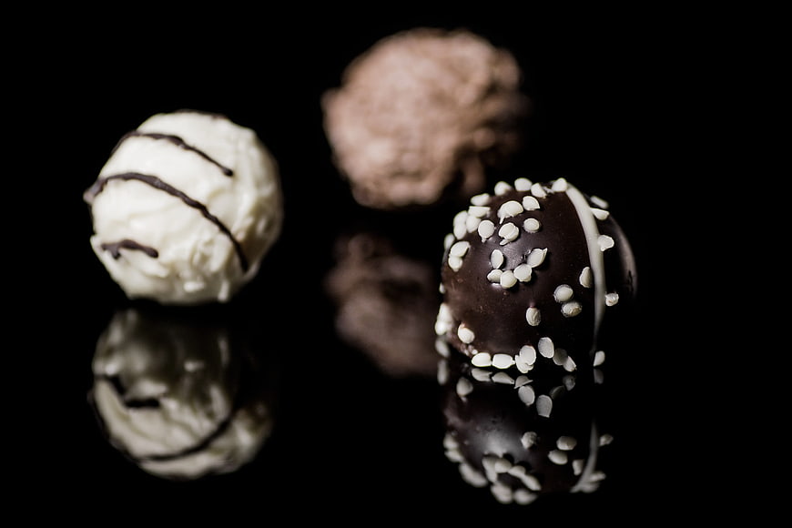 Assorted Chocolate Truffles on Black Background