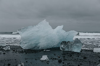 Large Blue Glacier Ice Chunk on Black Sand Beach